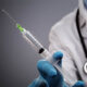 Testosterone Therapy Denver: Doctor with syringe and stethoscope