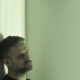 Testosterone Therapy Denver | Nervous man leaning on wall with withdrawal symptoms at a hospital room