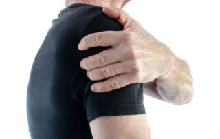 Man having shoulder pain | Denver Stem Cell Therapy