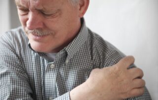 Old man having shoulder pains that needs Denver Stem Cell Therapy